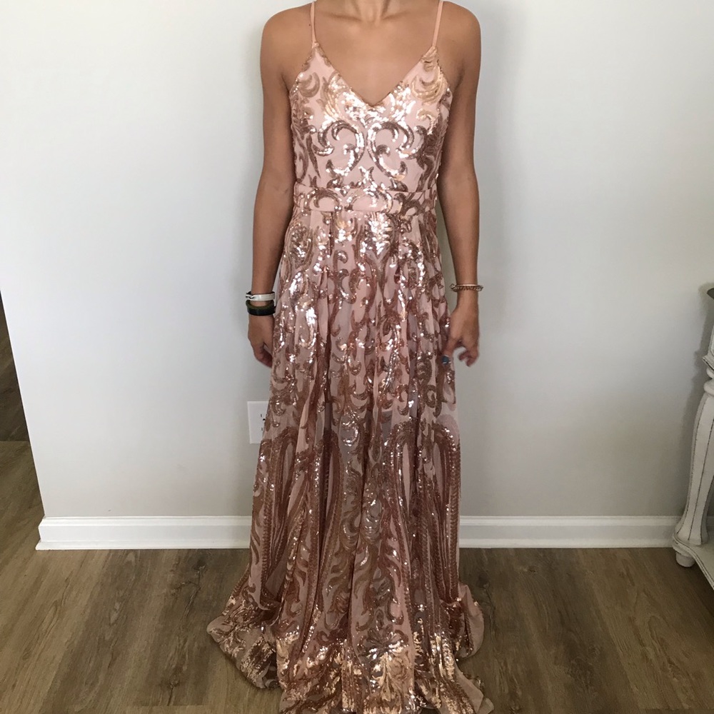 Long, spaghetti strap, sequin prom dress.